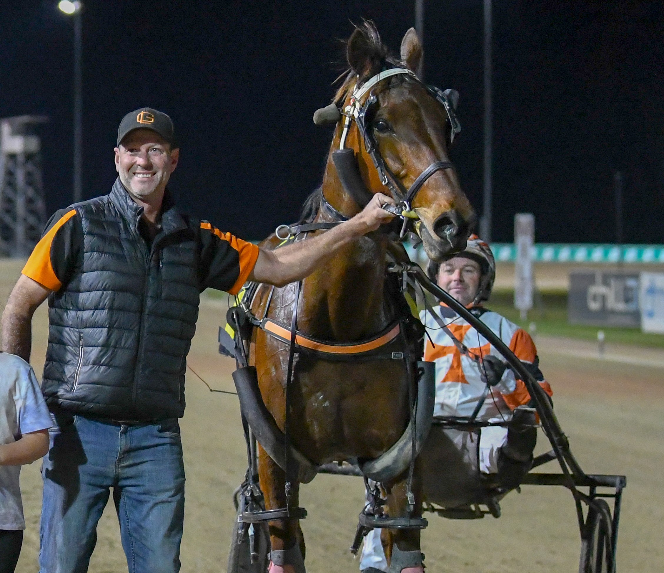 MILESTONE: Troy Williams (left) leads in Caulonia Courage (Rob Morris) after a recent Menangle win.